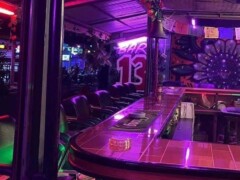 Bar 13, Koh Chang, Thailand, with bar and neon lights, now offering cannabis flower.