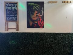 Green Family, Pai, Mae Hong Son: Welcome sign listing cannabis, alcohol, drinks; artwork of person smoking cannabis.