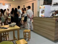 Green Family weed lounge in Pai, Mae Hong Son, with people playing pool and a bar area.