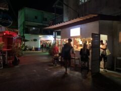 Exterior of Harweed Moon cannabis shop in Chiang Rai, Thailand. Open air terrace with customers and the dispensary is open.