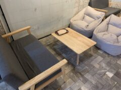 Interior of Harweed moon Bud Dispensary, Huai Khwang, Bangkok. Modern seating and coffee table. Cannabis shop vibe.