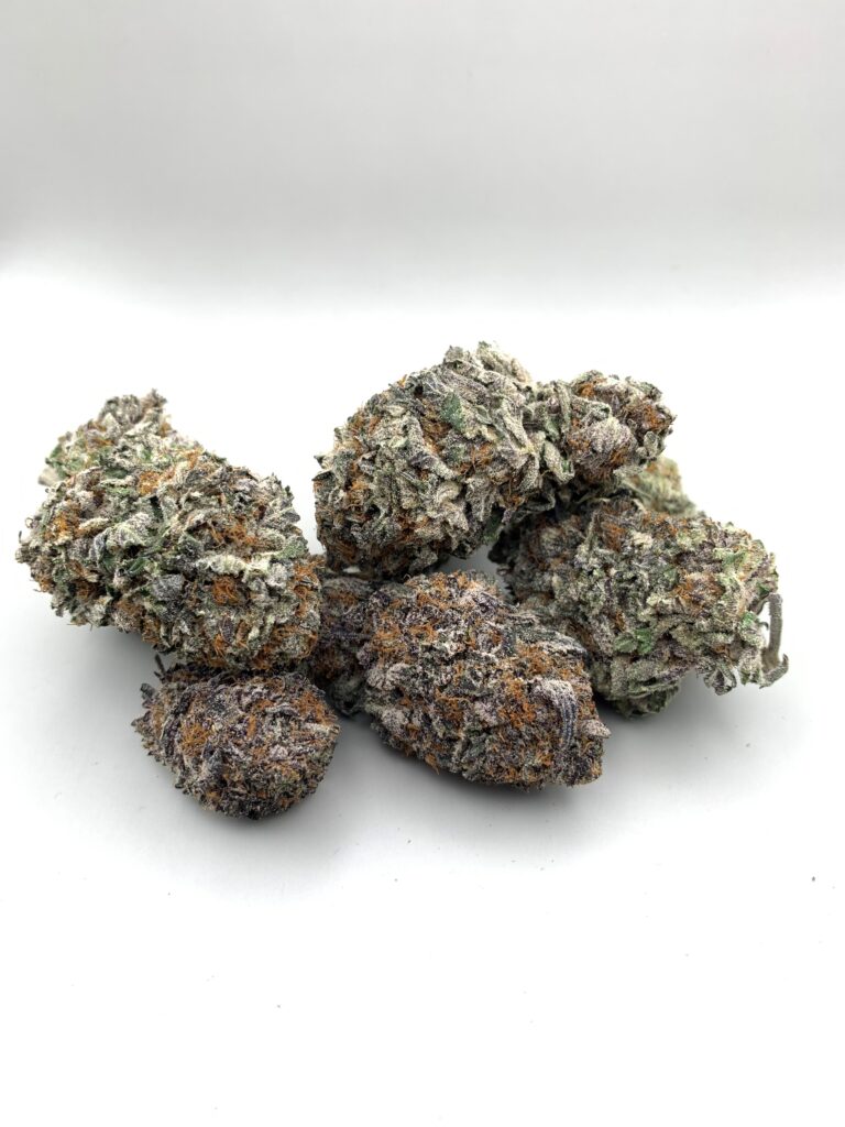 Six cannabis buds, showcasing green, purple, and orange hues against a white background.
