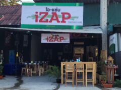Exterior of iZAP Restaurant and Sports Bar, Pa Daet, Chiang Mai, Thailand, with sign, tables, and chairs.