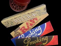 Smoking accessories (grinder, rolling papers) from Green Farm, Ubolratana District, Khon Kaen, Thailand.