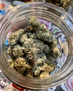 Jar filled with cannabis buds.
