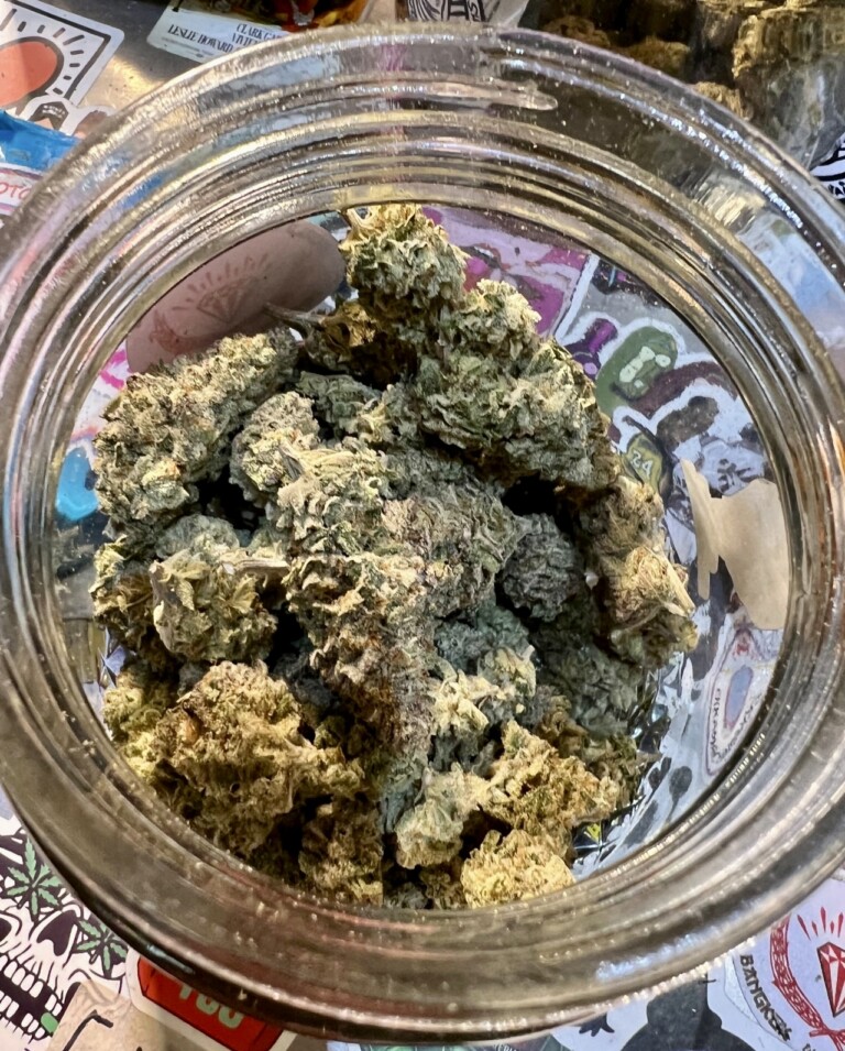 Jar filled with cannabis buds.