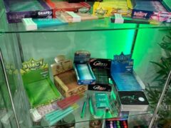 Smoking accessories and rolling papers display at El Patron Dispensary in Hua Hin, Thailand.