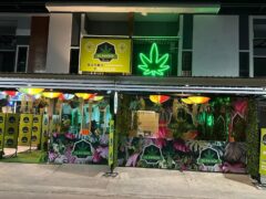 Exterior of El Patrón Dispensary in Hua Hin, Thailand, featuring cannabis leaf signage.