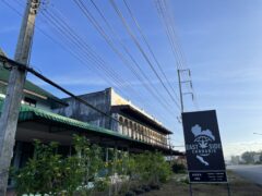 Exterior of East Side Cannabis Dispensary in Takua Pa, Phang-nga, Thailand, with sign, cannabis shop.