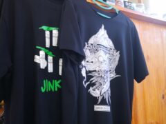 Two black t-shirts from local brands, 