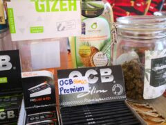 OG Cafe in Ko Lanta Yai, Krabi, Thailand, display of smoking accessories, OCB Slim rolling papers, and cannabis flower.