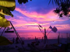 Beachfront sunset view at OG Cafe in Ko Lanta Yai, Krabi, Thailand.