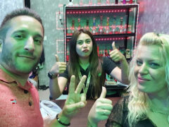 Smokey's Ao Nang cannabis shop in Ao Nang, Krabi with staff and customers smiling, thumbs up.