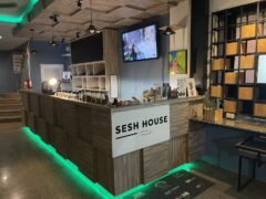 Interior of Sesh House cannabis shop in Krabi, Thailand, showing the counter and cannabis flower selection.