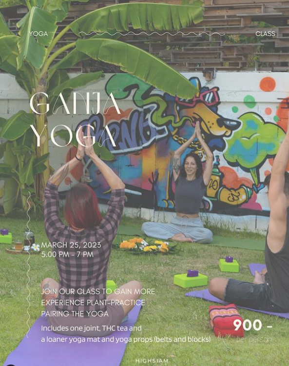 People practicing yoga outdoors on yoga mats with a graffiti wall backdrop.
