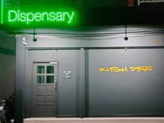Kush Dee cannabis dispensary entrance, Pattaya, Thailand, featuring a green 
