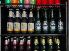 Fridge at Kush Dee Pattaya cannabis lounge stocked with Singha, Chang, Leo, Heineken beer, plus soft drinks.