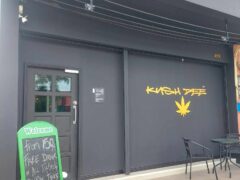 Exterior of Kush Dee dispensary, Pattaya, Thailand. Cannabis leaf logo and welcome sign visible. Weed shop.