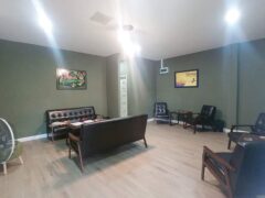 Interior of Kush Dee - Dispensary & Lounge in Pattaya, Thailand. Lounge area with seating, cannabis cafe vibe.