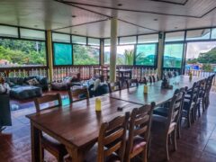 Cafe area at Denzpensary overlooking Patong Bay, Kathu, Phuket, featuring seating for relaxation.