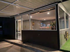 Exterior of 420 Cannabis @Naiyang Beach Phuket dispensary in Phuket, Thailand, featuring glass storefront with interior displays.