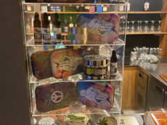 Interior display at BLOW PATONG in Patong, Phuket, showing smoking accessories, CBD products and grinders.