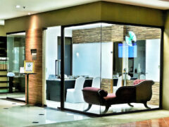 Interior of Cannabis Dispensary Smokin' Phantom in Pa Tong, Phuket, Thailand. Modern design, glass encased, chaise lounge.