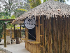 Exterior of Cannabis & Ice Cream@La’Luca x H1VE, a dispensary in หาดในยาง, Phuket, Thailand, bamboo hut style.