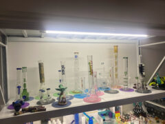 Smoking accessories at CANNACOF cannabis shop, Udon Thani, Thailand. Glass bongs and head shop supplies on display.