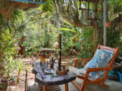 Chillout Green Zone cannabis cafe in Sila, Khon Kaen, Thailand. Relaxed outdoor setting with smoking accessories.