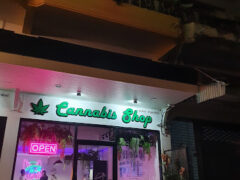 Choopcheewa Cannabis Shop exterior in Cha-am, Phetchaburi. Weed dispensary with neon sign and cannabis leaf logo.