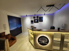 Elm Farm Cannabis shop interior in Saphan Sung, Bangkok. Reception area with flowers and smoking accessories on display.