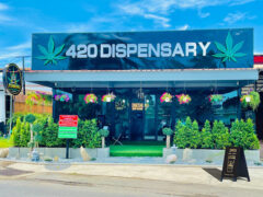 FEIROU-HUA HIN 94 cannabis dispensary exterior, Soi 94, Hua Hin, Thailand. Cannabis shop with flower baskets and greenery.