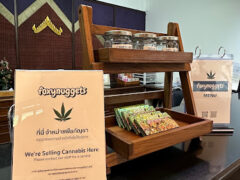 foxynuggets Ganja Shop counter display in Si Sa Ket, Thailand. Sign reads 