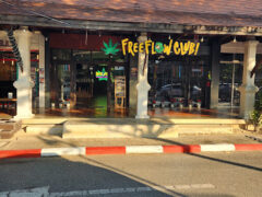 Exterior of FreeFlow Club cannabis shop in Tambon Chang Phueak, Chiang Mai, Thailand, featuring weed leaf sign.