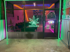 Galaxy cannabis dispensary exterior, Pru Yai, Nakhon Ratchasima. Neon cannabis leaf sign.