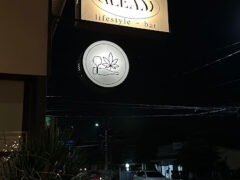 GLEAM Weed Dispensary sign in Pakkret, Nonthaburi, Thailand. Cannabis leaf logo visible.