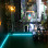Blue line and blurred city at night with streetlights.