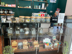 Interior of Green Room Phuket in Chalong, Phuket, showing cannabis flower jars and smoking accessories.