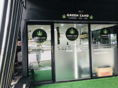 GREENLAND cannabis shop exterior, Bang Muang, Nonthaburi, Thailand. Minimalist design; cannabis dispensary.
