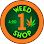 A circular sign with orange border. It says "Weed 1 Shop" with a cannabis leaf symbol.