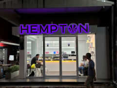 Exterior of HEMPTON Dispensary @ Chiang Rai on Thai Viwat Alley, Chiang Rai. Cannabis shopfront at night.
