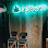 Glowing green neon sign with stylized cannabis leaf and "Ryerson" text.