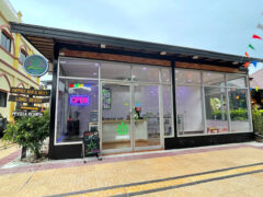 Exterior of Hippiesland Phi Phi cannabis shop in เกาะพีพี, Thailand, with neon 