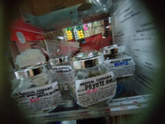 Jars of cannabis flower strains (Runtz, Peyote Gorilla, Super Lemon Haze) at ร้านเจ้าพ่อกัญชา, Lak Si, Bangkok.