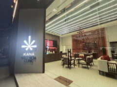 Exterior of KANA Wellness Clinic in Sukhumvit 69, Bangkok, showing entrance with sign and seating area.