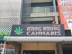Exterior of King Kong Cannabis in Sakhu, Thalang District, Phuket, cannabis shop with signage and people.