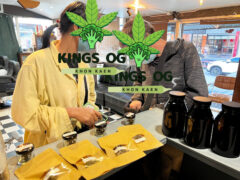Inside Kings OG cannabis shop, Khon Kaen, Thailand. Customers purchasing cannabis flower.