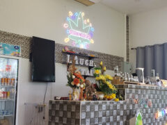 Laughtale cannabis shop interior, Bo Put, Ko Samui. Weed dispensary with cannabis leaf neon sign.