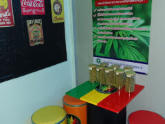 Lung Chan 420 Shop interior, Phunphin, Surat Thani. Display of cannabis flower jars and accessories. Cannabis dispensary, Thailand.